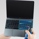 Apple has a guide to how to clean your keyboard.